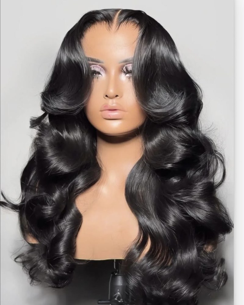 A long body wave wig unit shown on a display mannequin