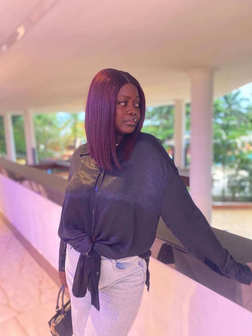 A Kinkie&rsquo;s Place customer wearing a wine-coloured straight bob